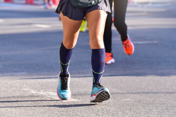 Marathon Running In The Light Of Morning, People Running On City Road Detail On Legs, Step, Walk And Outdoor Exercise Activities Concept.