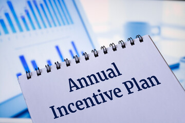 Notepads with the inscription Annual Incentive Plan. Business concept