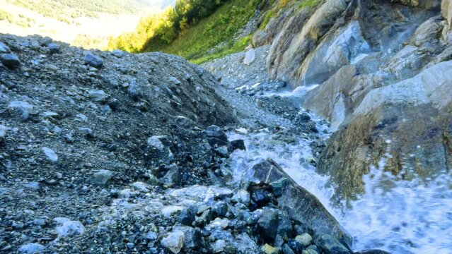 slow-mo large nice water cascade in Arkhyz mountains in the evening
