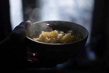 Pasta on plate. Sausages with pasta. Food in white plate.
