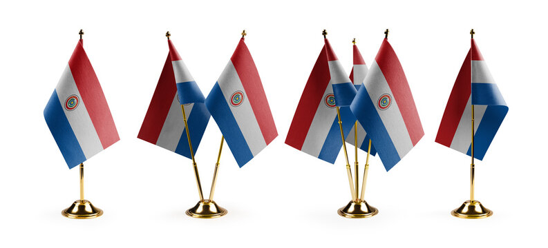 Small national flags of the Paraguay on a white background