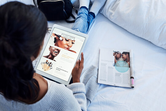 Makeup, tablet and woman influencer reading social media, online or internet blog about beauty in her bedroom. App, website and young person learning cosmetics from the web and research a magazine