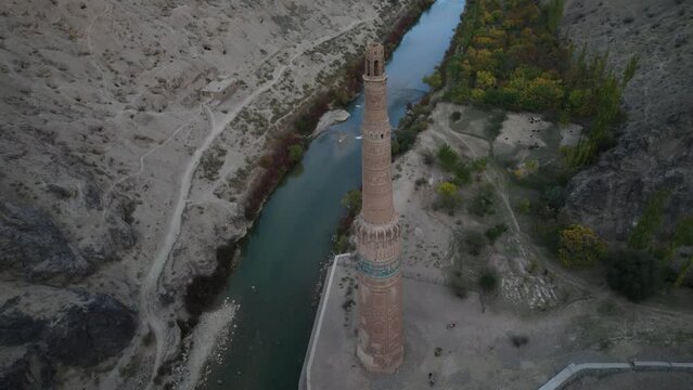 Stunning Jam Minaret on Hari riverbank, Shahrak District in Ghowr Province, Afghanistan. Aerial tilt down directly above