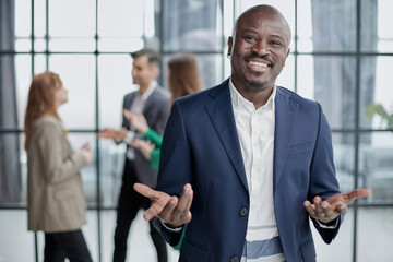 Handsome african american executive businessman in modern office