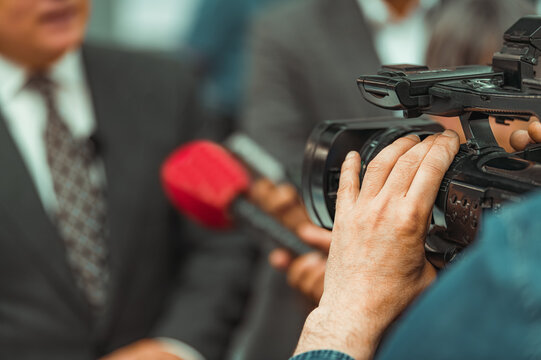 Businessman talking in a trade show interview