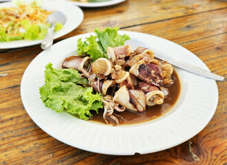 Thai food Fried squid rings with sweet sauce.