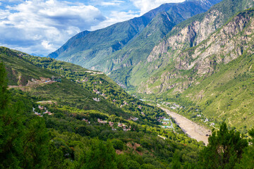 Fototapeta premium West Sichuan Plateau scenery- Danba tibetan village. Taken on the Danba, Sichuan, China. Copy space for text, background image, with the river down the valley, horizontal image