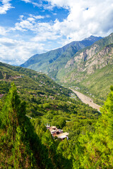 West Sichuan Plateau scenery- Danba tibetan village. Taken on the Danba, Sichuan, China. Copy space for text, background image, with the river down the valley, vertical image