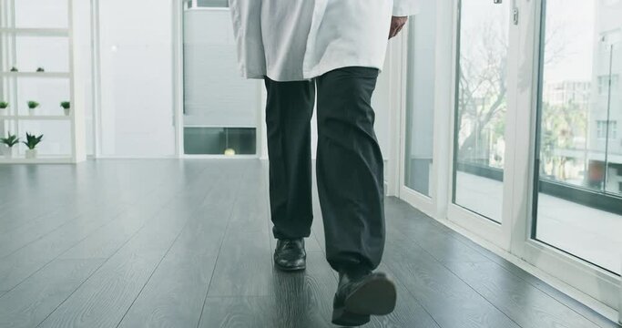 medical, walking and legs of doctor in hospital hallway for physician, expert and specialist. Medicine, healthcare and professional with male person in clinic corridor for consulting and cardiology
