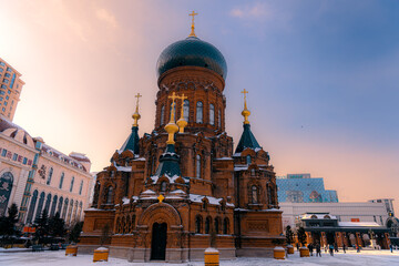 Fototapeta na wymiar HARBIN, CHINA - JANUARY 2nd, 2022: Saint Sophia Cathedral in Harbin, was built in 1907 and turned into a museum in 1997. It stands at 53.3 meters (175 ft) tall. The renowned landmark of HARBIN.