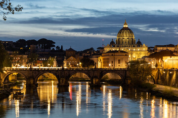 Fototapeta na wymiar saint peter basilica city rome sunset tevere bridge