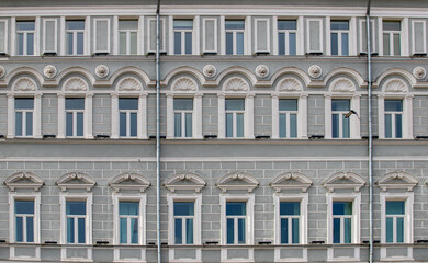 Fototapeta na wymiar high-rise building on the background of windows