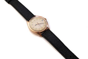 Golden wrist watch on a white background, vintage watch from the times of the ussr