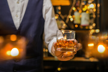 Bartender pouring Whiskey, on  bar