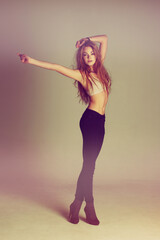 Dance fashion, young woman and portrait of a dancer model with casual style and confidence. Isolated, studio background and dancing pose of a female person with youth, body freedom and natural beauty