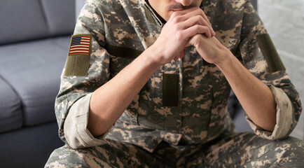 National American holidays. male praying soldier o with an American flag. Copy space. The concept of Veterans Day