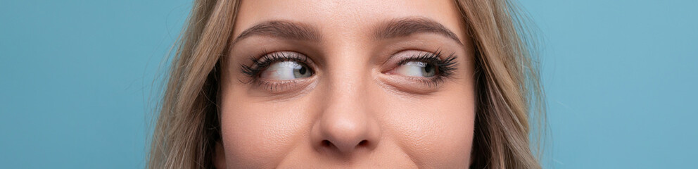 Obraz premium look of a happy European well-groomed girl blond on a blue background