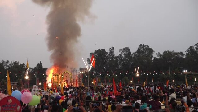 October 19th 2022, Dehradun, Uttarakhand, India. Ravana, Kumbkarana and Meghnath effigies on fire during Vijayadashmi festival fair with people all around.