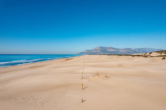 Beautiful Patara sandy beach with blue sea Kalkan, Antalya Turkey. Aerial top view from drone