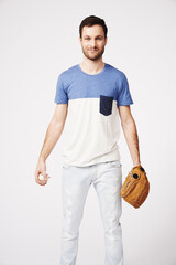 Man, studio and holding baseball with glove for safety, pitch or catch in game, sport or contest by...