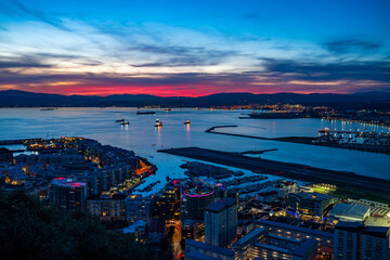 Colorful sunset over Gibraltar town and  the Bay of Gibraltar, UK