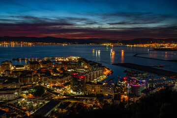 Fototapeta na wymiar Colorful sunset over Gibraltar town and the Bay of Gibraltar, UK