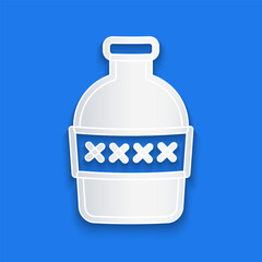 Paper cut Bottle of water icon isolated on blue background. Soda aqua drink sign. Paper art style. Vector