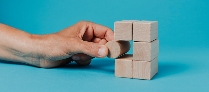 man playing with building blocks, banner format