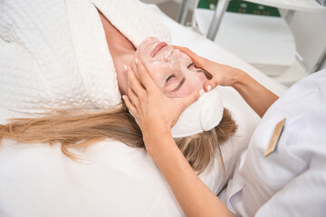 Patient lies on the table at the doctors cosmetologist