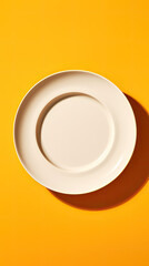 An overhead view of a white plate, isolated on a solid background, generative AI