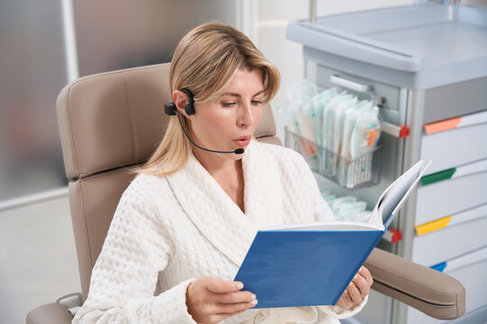 Female patient on modern voice staging procedure with forbrein headset