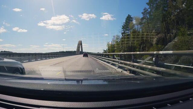 Driving across the Svinesund bridge on the border between Norway and Sweden. Driving into Sweden.