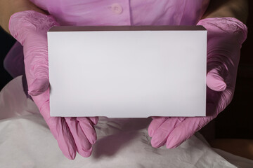 pharmacist showing white blank medicine box with pharmacy store shelves background