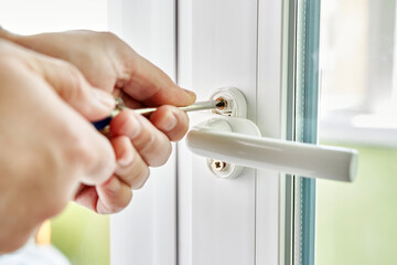 The handle is screwed to the window frame. Maintenance of metal-plastic windows.