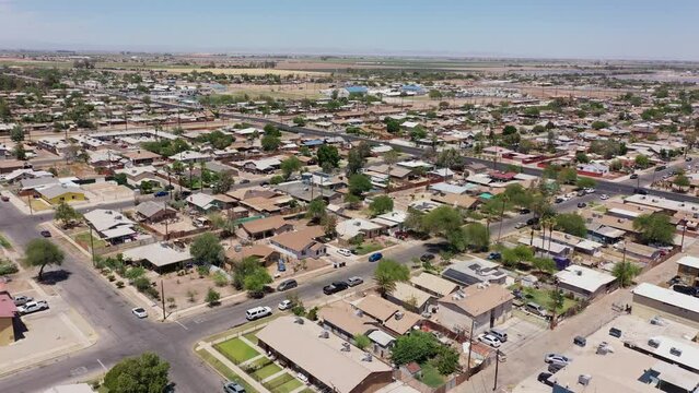 El Centro, California, USA - May 27, 2022: Afternoon sunlight shines on housing in the urban downtown core of El Centro.