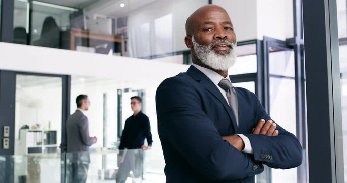 Corporate, focus and a business black man arms crossed in his office for work with focus or determination. Portrait, management and professional with a mature male CEO in his company for leadership