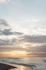 Naklejka na ściany i meble Background image of sea waves at sunset, sunrise time.