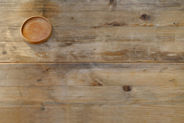 round drink stand on old table, wooden texture, Background for design, close-up, copy space, empty...