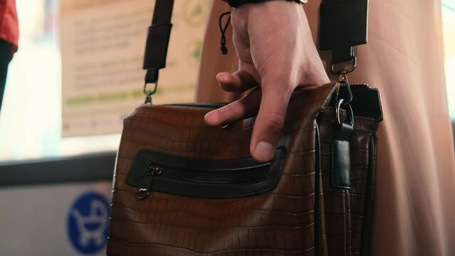 Theft from a bag on public transport.