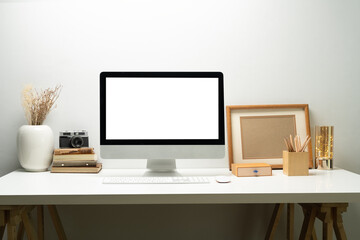 Bank screen of desktop computer on desk at workplace of graphic designer, blogger. Empty display for montage your graphic display