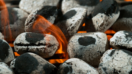 Freeze Motion Shot of Glowing Charcoal Briquettes on Garden Grill, Macro Shot