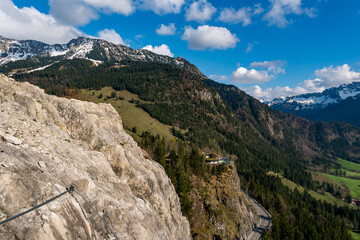 Fototapeta na wymiar Climbing on the Ostrachtaler via ferrata at the Oberjochpass near Bad Hindelang