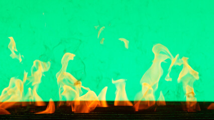 Fire flames with cast iron grate isolated on green screen background