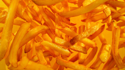 Freeze Motion Shot of Flying Fresh French Fries, Close-up