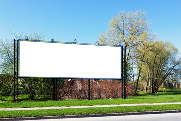 blank billboard next to tree in background