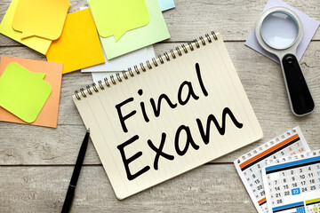 calendar and stickers on the desktop. text on the page Final Exam.