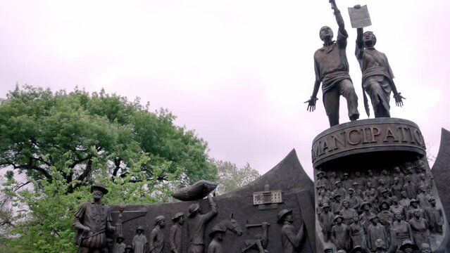 Texas African American History statue on the grounds of the Texas state capitol building in Austin, Texas with gimbal video panning left to right.