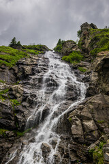 Capra Waterfall next to Transfagarasan Road in Carpathian Mountains in Romania