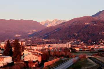 Fototapeta na wymiar Sunrise in Schio (Veneto, Italy) with view of the Little Dolomites