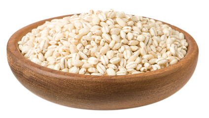 Uncooked highland barley in the wooden plate, isolated on white background.